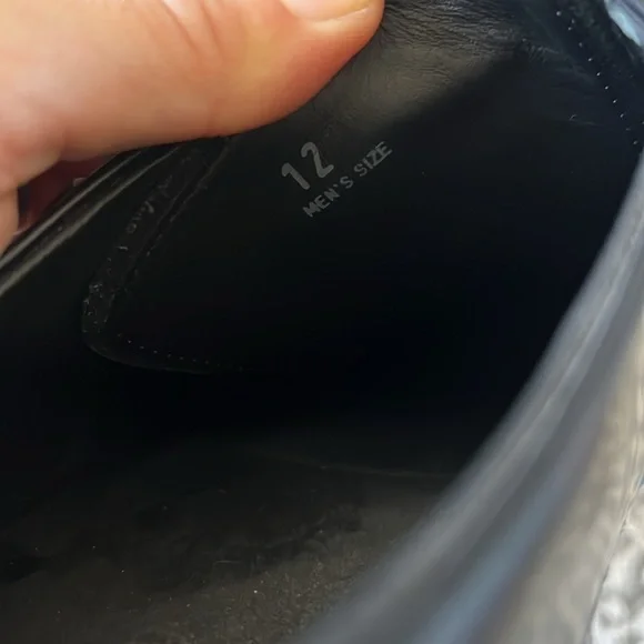 Tod’s black buckle loafers